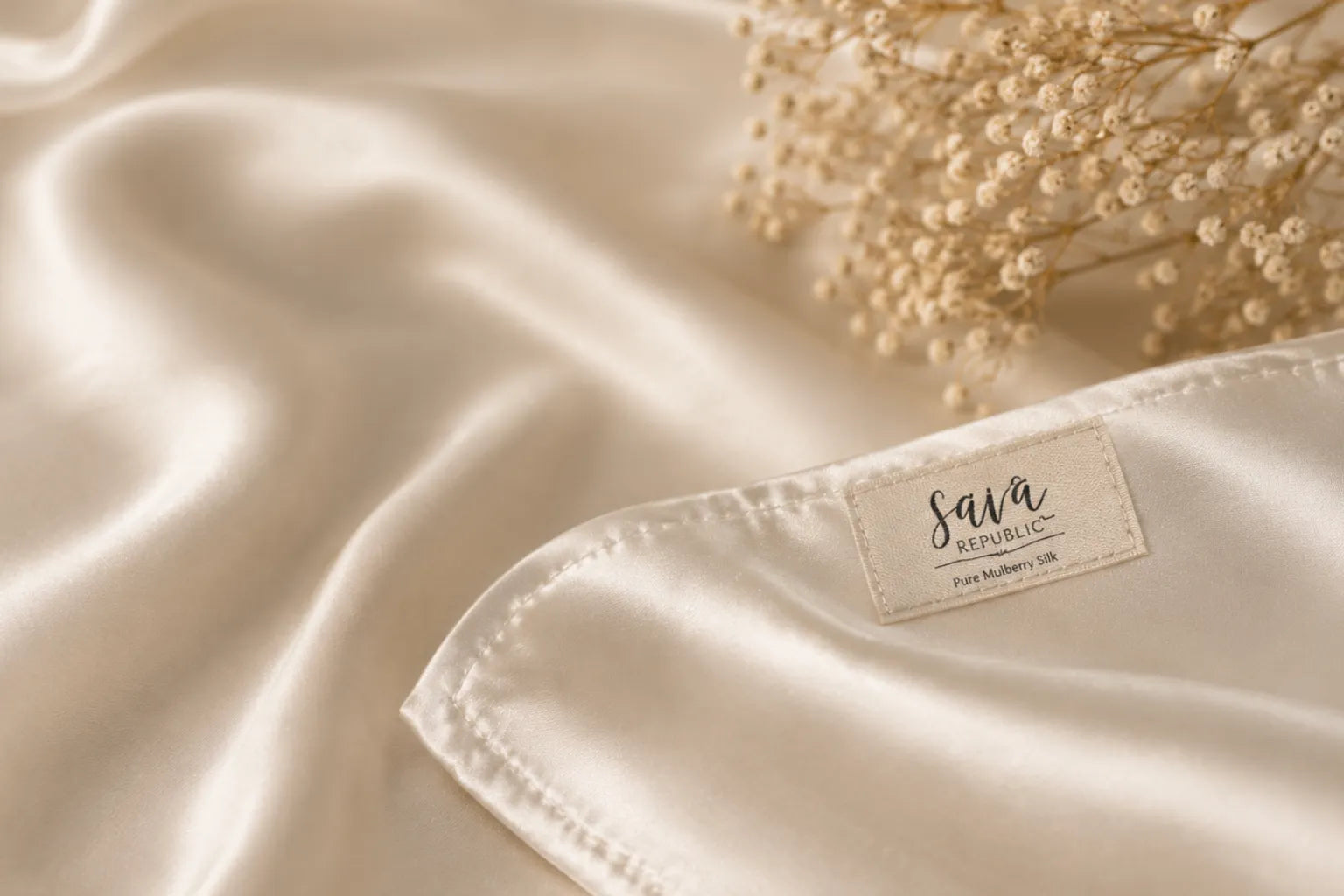 Premium mulberry silk fabric with Sava Republic signature label, showcasing carefully crafted details and timeless quality.
